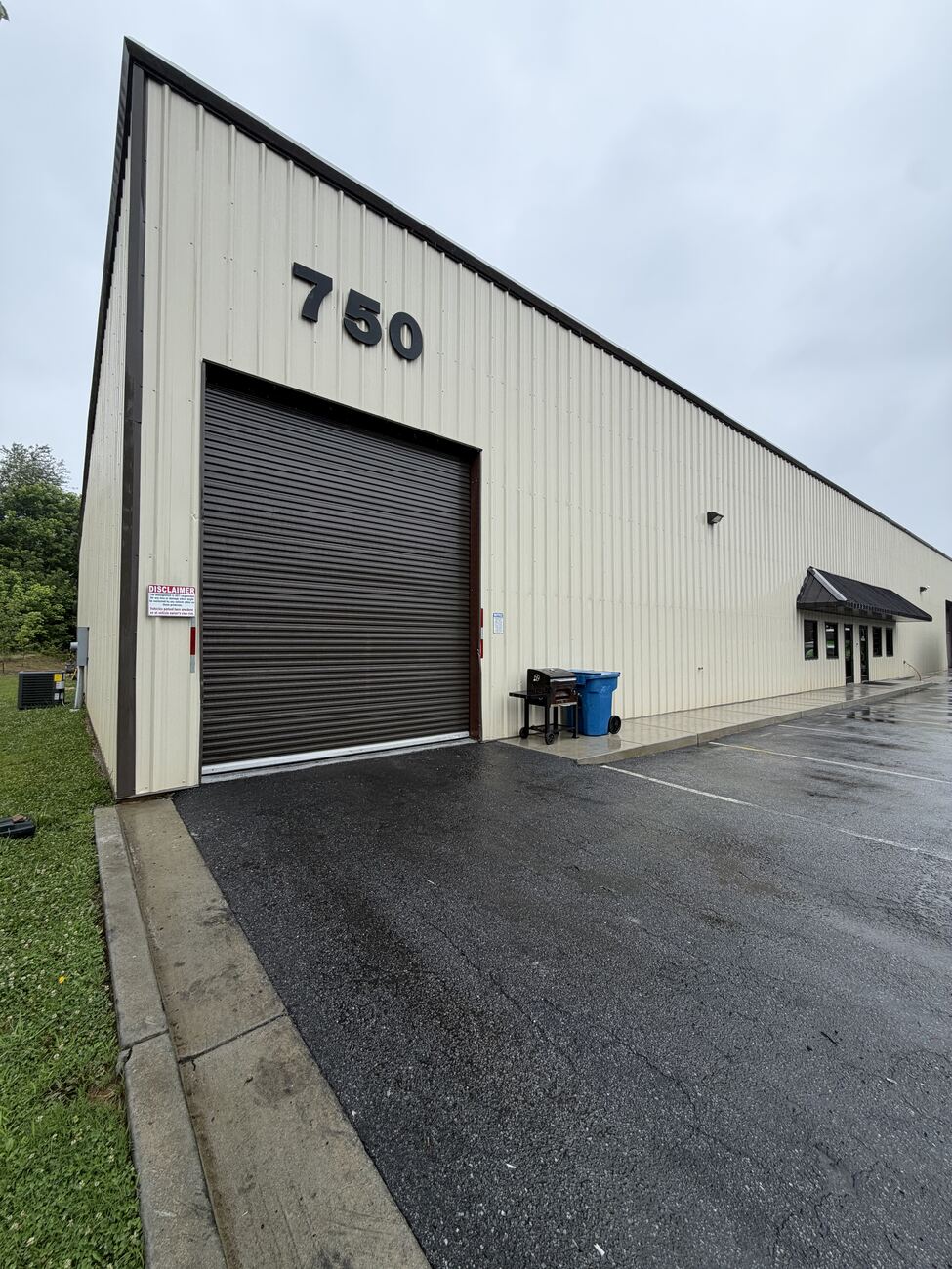 Commercial building driveway after cleaning — uniform and restored