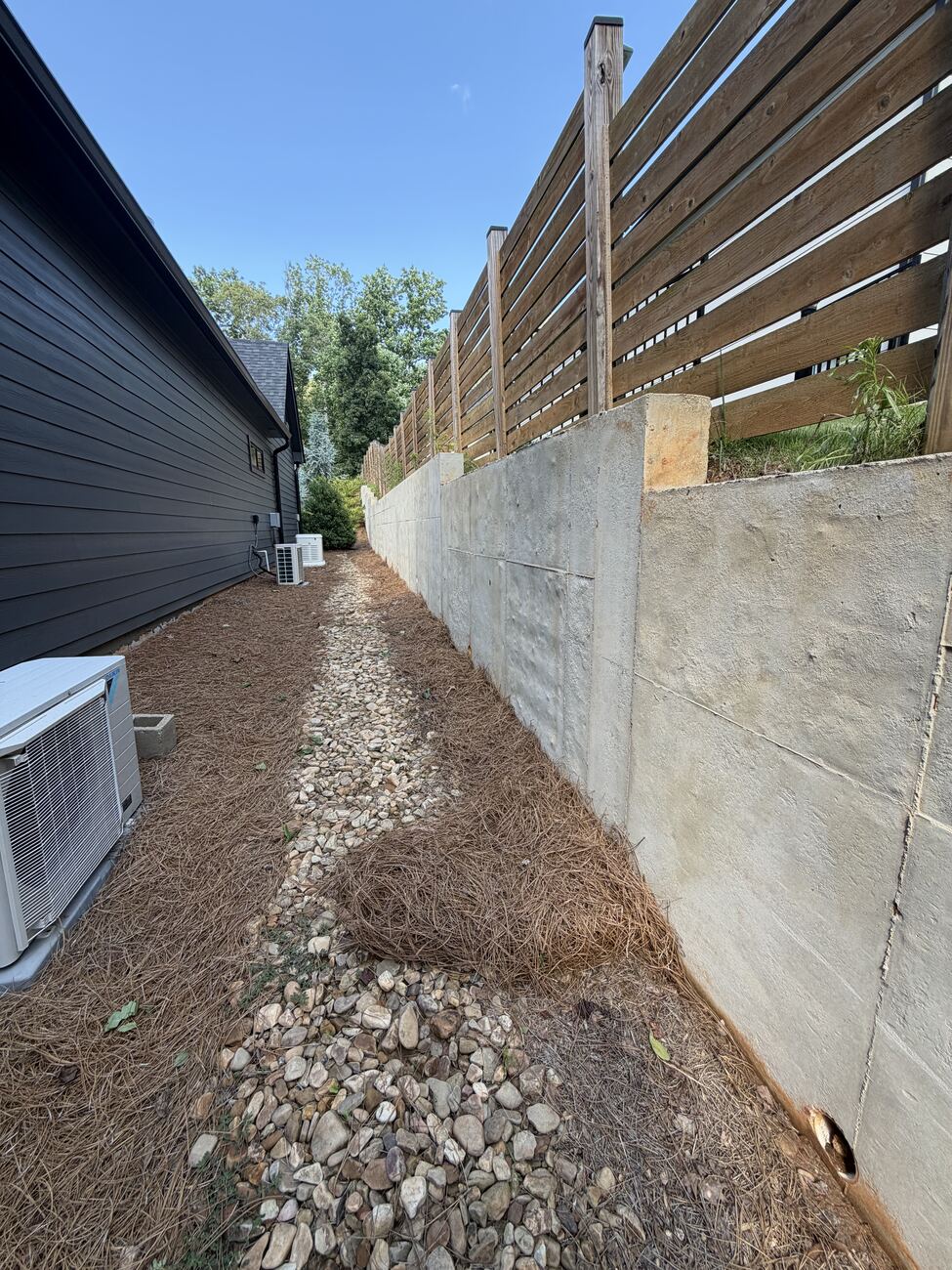 Retaining wall after cleaning — stains removed, clean concrete