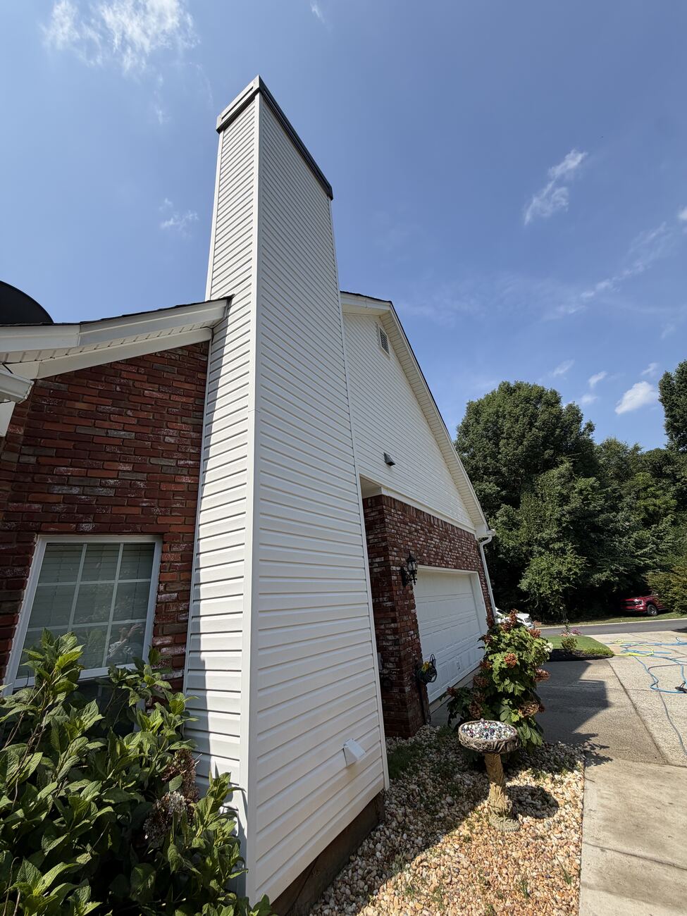 Chimney siding after soft wash — bright white again