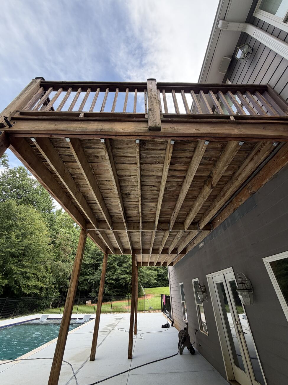 Underside of a wood deck after cleaning