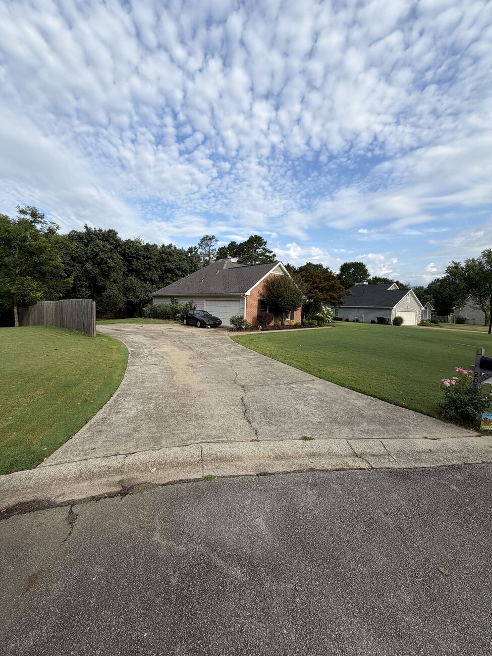 Concrete driveway before cleaning — darkened with grime